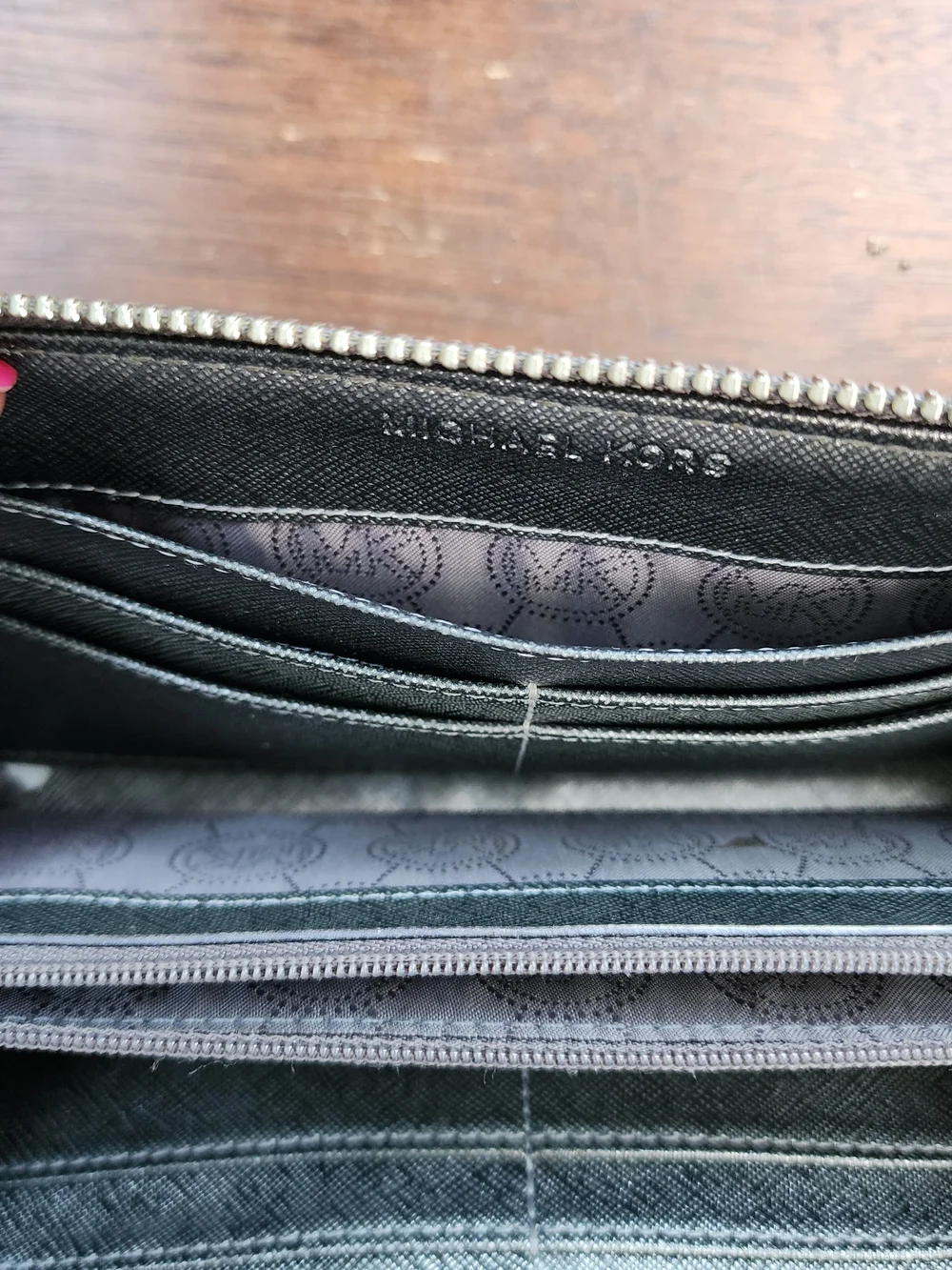 Michael Kors Metallic Pewter Monogram Embossed Zip Around Wallet